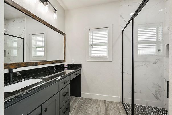 Bathroom, Dual Sink Vanities, Glass Shower, Interior, Marble Walls, Wood Texture Flooring