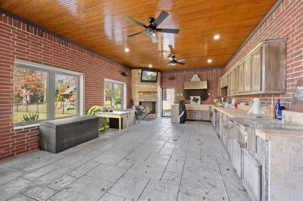 Fireplace, Interior, Living room, Recessed Lighting, Stone Walls, Wooden Ceilings