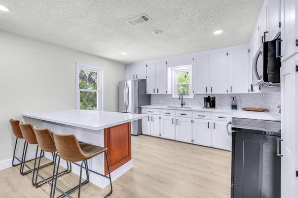 Interior, Kitchen, Recessed Lighting, Stainless Steel Appliances, Wood Texture Flooring