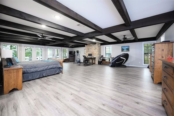 Bedroom, Fireplace, Interior, Recessed Lighting, Stone Walls, Wooden Beams, Wood Texture Flooring