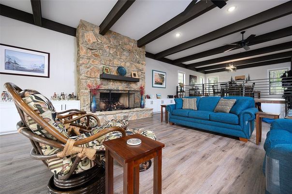 Dining room, Fireplace, Interior, Living room, Recessed Lighting, Stone Walls, Wooden Beams, Wood Texture Flooring