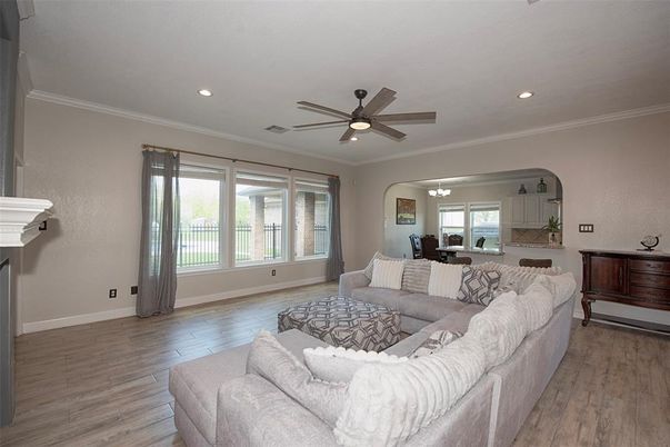Dining room, Fireplace, Interior, Living room, Recessed Lighting, Wood Texture Flooring