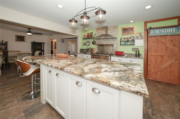 Dining room, Interior, Kitchen, Pendant Lights, Recessed Lighting, Stainless Steel Appliances, Wood Texture Flooring