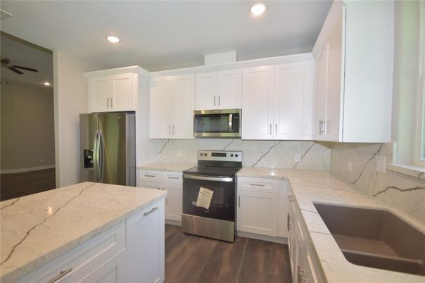 Interior, Kitchen, Recessed Lighting, Stainless Steel Appliances, Wood Texture Flooring