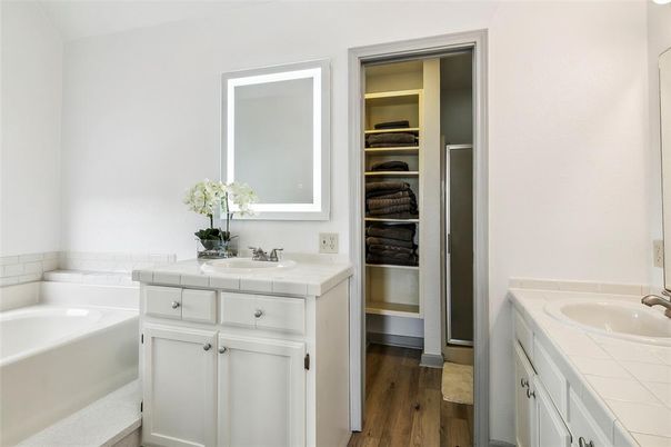 Bathroom, Dual Sink Vanities, Interior, Tile Countertops, Walk-in Closets, Wood Texture Flooring