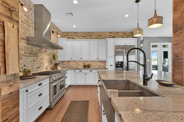 Interior, Kitchen, Pendant Lights, Recessed Lighting, Stainless Steel Appliances, Stone Walls, Wood Texture Flooring
