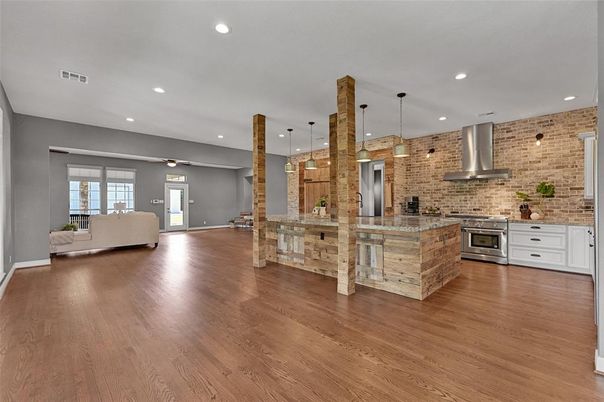 Interior, Kitchen, Living room, Pendant Lights, Recessed Lighting, Stainless Steel Appliances, Stone Walls, Wood Texture Flooring