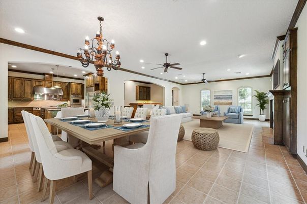 Chandelier, Dining room, Fireplace, Interior, Kitchen, Living room, Recessed Lighting, Stainless Steel Appliances