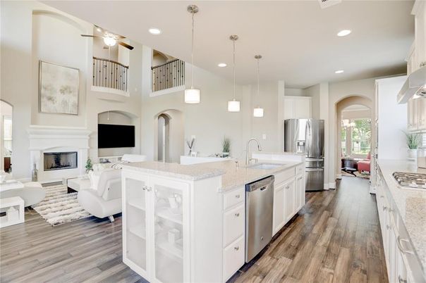 Fireplace, Interior, Kitchen, Living room, Pendant Lights, Recessed Lighting, Stainless Steel Appliances, Wood Texture Flooring