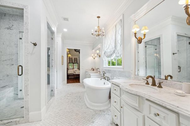 Bathroom, Chandelier, Dual Sink Vanities, Free Standing Baths, Glass Shower, Interior, Marble, Marble Walls, Recessed Lighting