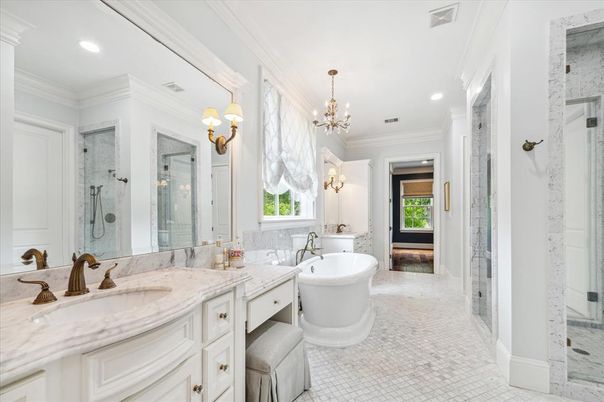 Bathroom, Chandelier, Dual Sink Vanities, Free Standing Baths, Glass Shower, Interior, Marble, Marble Walls, Recessed Lighting