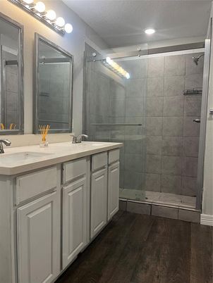 Bathroom, Dual Sink Vanities, Glass Shower, Interior, Recessed Lighting, Wood Texture Flooring