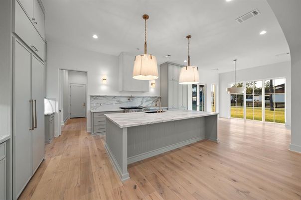 Interior, Kitchen, Marble Walls, Pendant Lights, Recessed Lighting, Wood Texture Flooring