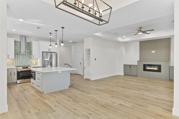 Fireplace, Interior, Kitchen, Pendant Lights, Recessed Lighting, Stainless Steel Appliances, Wood Texture Flooring