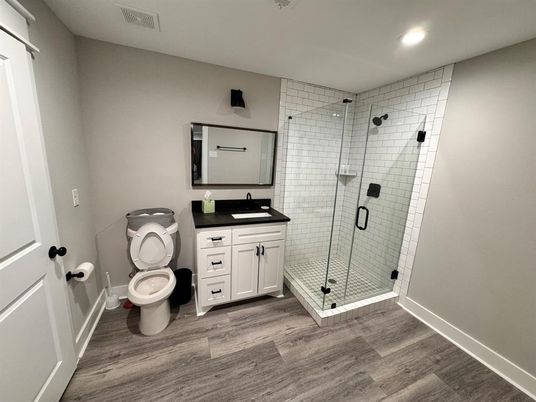 Bathroom, Dual Sink Vanities, Glass Shower, Interior, Recessed Lighting, Wood Texture Flooring