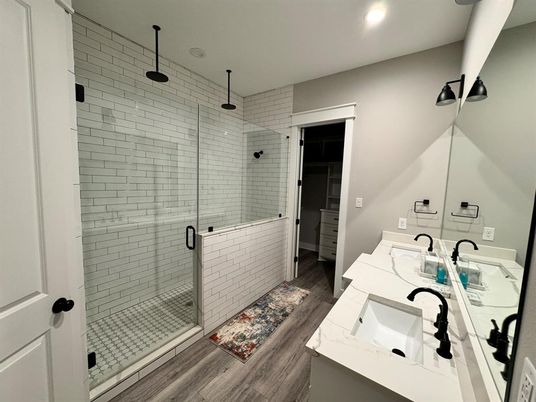 Bathroom, Dual Sink Vanities, Glass Shower, Interior, Recessed Lighting, Wood Texture Flooring