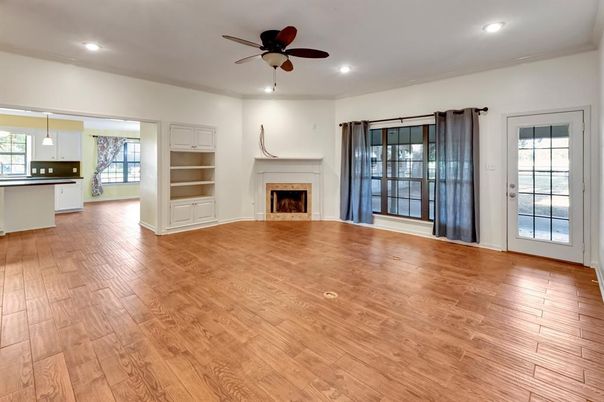 Empty room, Fireplace, Interior, Kitchen, Pendant Lights, Recessed Lighting, Wood Texture Flooring
