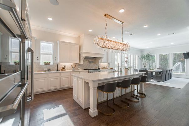 Chandelier, Dining room, Interior, Kitchen, Pendant Lights, Recessed Lighting, Stainless Steel Appliances, Wood Texture Flooring