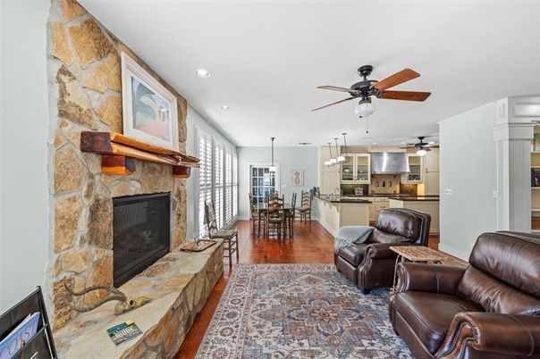 Dining room, Fireplace, Interior, Kitchen, Living room, Pendant Lights, Recessed Lighting, Stainless Steel Appliances, Stone Walls, Wood Texture Flooring