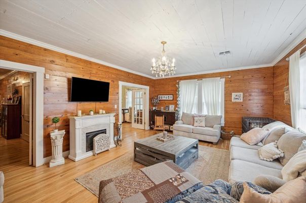 Chandelier, Fireplace, Interior, Living room, Wood Texture Flooring, Wooden Walls
