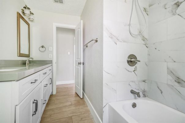 Bathroom, Dual Sink Vanities, Interior, Marble Walls, Wood Texture Flooring