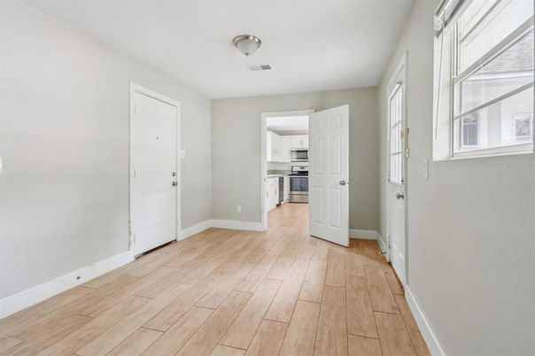 Empty room, Interior, Kitchen, Stainless Steel Appliances, Wood Texture Flooring