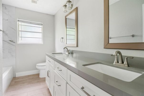 Bathroom, Dual Sink Vanities, Interior, Marble Walls, Wood Texture Flooring