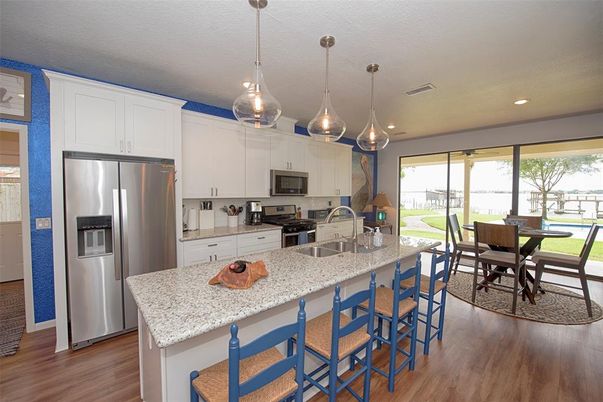 Dining room, Interior, Kitchen, Pendant Lights, Recessed Lighting, Stainless Steel Appliances, Wood Texture Flooring