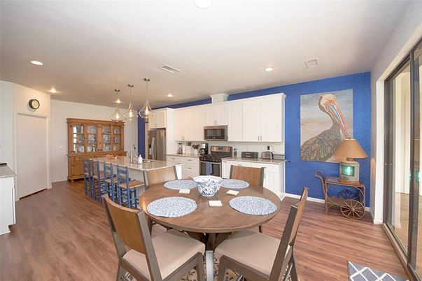 Dining room, Interior, Kitchen, Pendant Lights, Recessed Lighting, Stainless Steel Appliances, Wood Texture Flooring