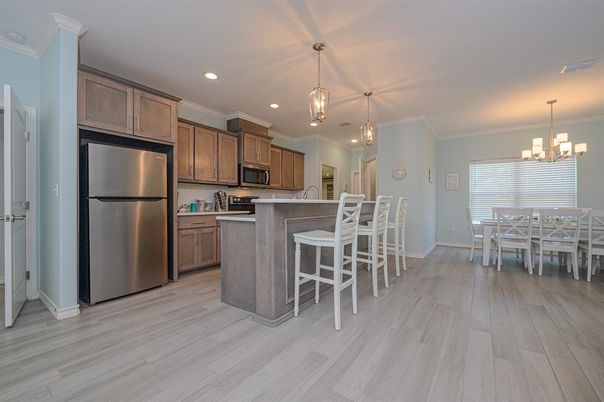 Chandelier, Dining room, Interior, Kitchen, Pendant Lights, Recessed Lighting, Stainless Steel Appliances, Wood Texture Flooring