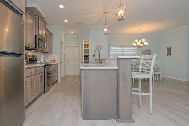Chandelier, Dining room, Interior, Kitchen, Pendant Lights, Recessed Lighting, Stainless Steel Appliances, Wood Texture Flooring