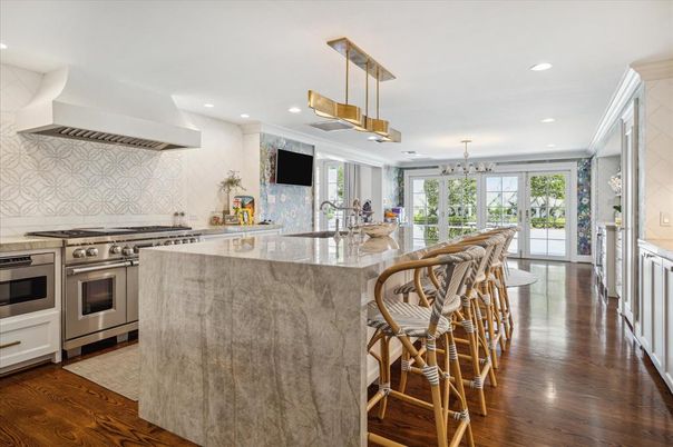 Interior, Kitchen, Marble Walls, Pendant Lights, Recessed Lighting, Stainless Steel Appliances, Wood Texture Flooring