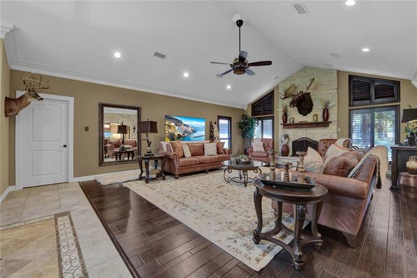 Fireplace, Interior, Living room, Recessed Lighting, Stone Walls, Wood Texture Flooring