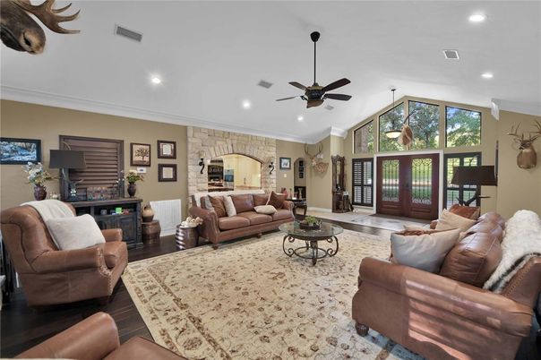 Fireplace, Interior, Living room, Recessed Lighting, Stone Walls, Wood Texture Flooring