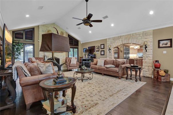 Fireplace, Interior, Living room, Recessed Lighting, Stone Walls, Wood Texture Flooring