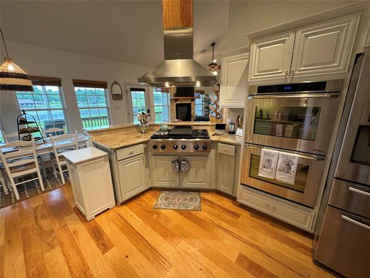 Dining room, Interior, Kitchen, Pendant Lights, Stainless Steel Appliances, Wood Texture Flooring