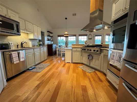 Dining room, Interior, Kitchen, Pendant Lights, Stainless Steel Appliances, Wood Texture Flooring