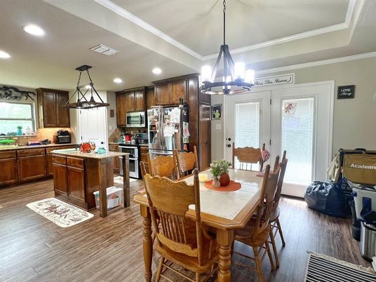 Chandelier, Dining room, Interior, Kitchen, Pendant Lights, Recessed Lighting, Stainless Steel Appliances, Wood Texture Flooring
