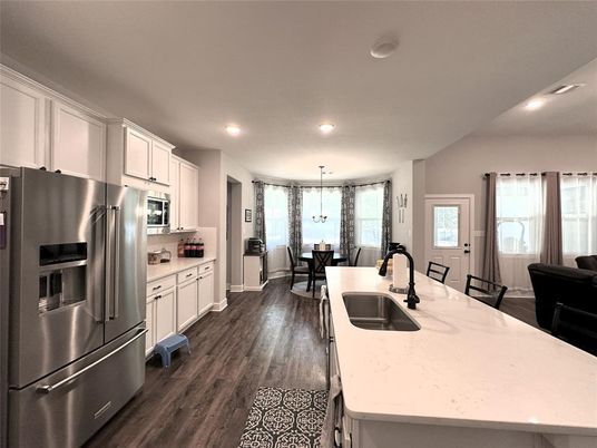 Dining room, Interior, Kitchen, Pendant Lights, Recessed Lighting, Stainless Steel Appliances, Wood Texture Flooring
