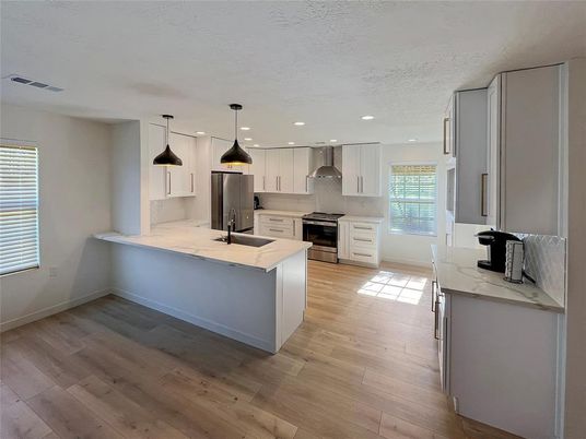 Interior, Kitchen, Pendant Lights, Recessed Lighting, Stainless Steel Appliances, Wood Texture Flooring