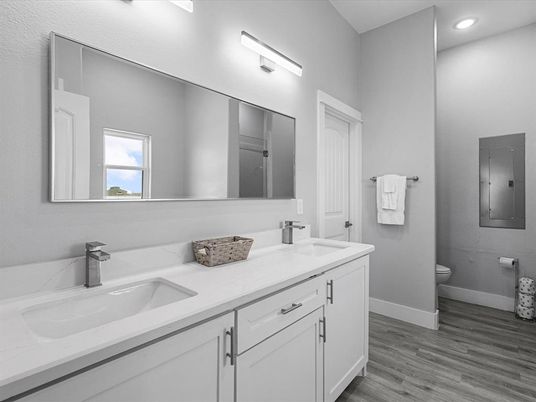 Bathroom, Dual Sink Vanities, Interior, Recessed Lighting, Wood Texture Flooring