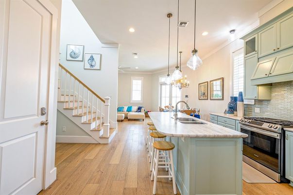 Chandelier, Interior, Kitchen, Living room, Pendant Lights, Recessed Lighting, Stainless Steel Appliances, Wood Texture Flooring