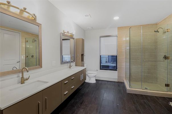Bathroom, Dual Sink Vanities, Glass Shower, Interior, Recessed Lighting, Wood Texture Flooring
