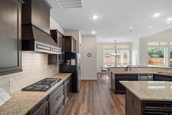 Chandelier, Dining room, Interior, Kitchen, Pendant Lights, Recessed Lighting, Stainless Steel Appliances, Wood Texture Flooring
