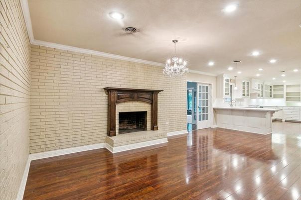 Chandelier, Empty room, Fireplace, Interior, Kitchen, Pendant Lights, Recessed Lighting, Stone Walls, Wood Texture Flooring