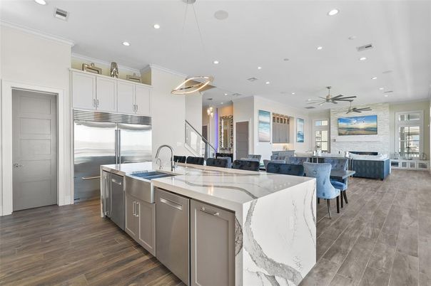 Fireplace, Interior, Kitchen, Living room, Pendant Lights, Recessed Lighting, Stainless Steel Appliances, Wood Texture Flooring