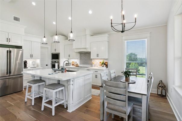 Chandelier, Dining room, Interior, Kitchen, Pendant Lights, Recessed Lighting, Stainless Steel Appliances, Wood Texture Flooring