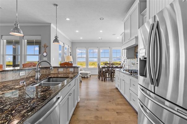 Dining room, Interior, Kitchen, Pendant Lights, Recessed Lighting, Stainless Steel Appliances, Wood Texture Flooring