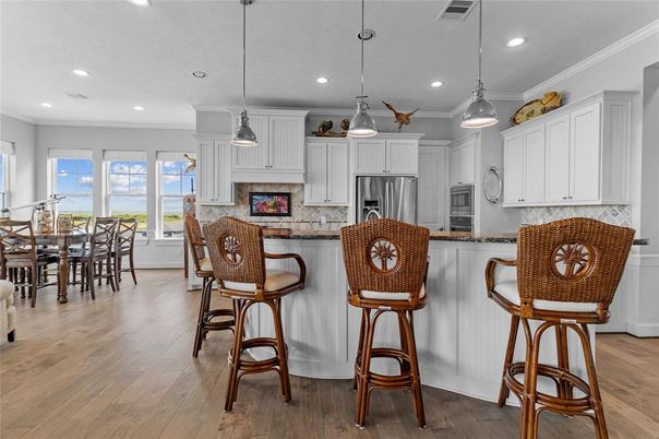 Dining room, Interior, Kitchen, Pendant Lights, Recessed Lighting, Stainless Steel Appliances, Wood Texture Flooring