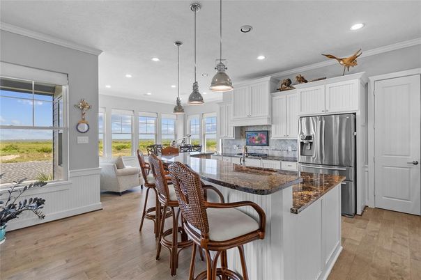 Dining room, Interior, Kitchen, Pendant Lights, Recessed Lighting, Stainless Steel Appliances, Wood Texture Flooring